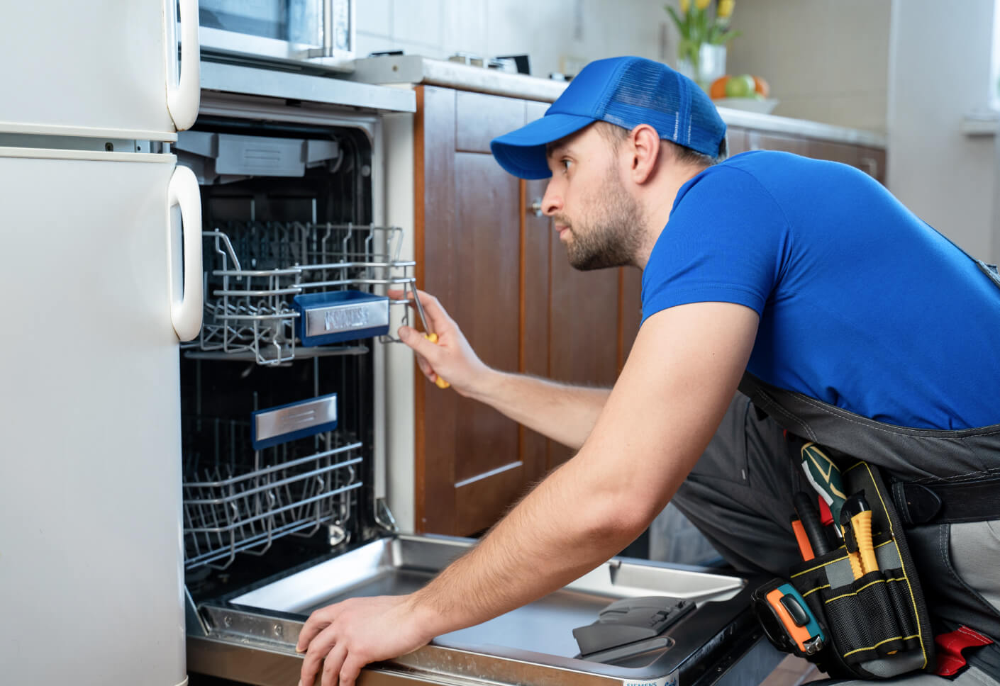 GRIT appliance repair technician working on dishwasher repair Abilene Texas
